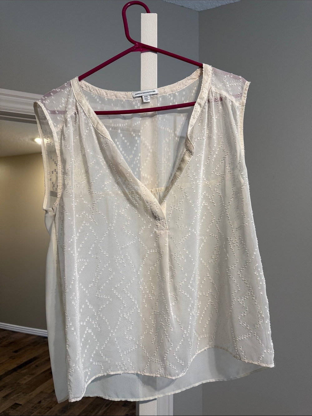 American Eagle Outfitters Ivory V-Neck Sleeveless shirt very sheer